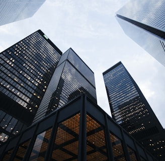 low angle photo of city high rise buildings during daytime